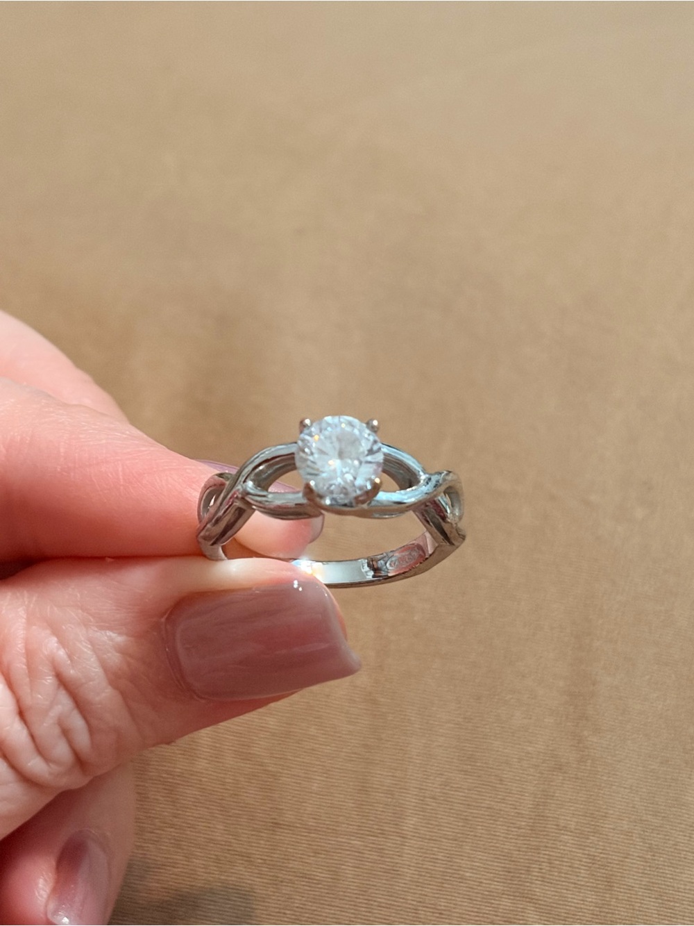 Solitaire Twist Silver Engagement Ring with Clear Stone